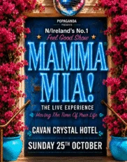 Vibrant hotel entrance with blue doors, blooming bougainvillaea, and event signage for "Mamma Mia!" show at Cavan Crystal Hotel.